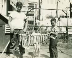 Petros at age 14, with trout caught from the tank at the Chicago Ampitheater Show.