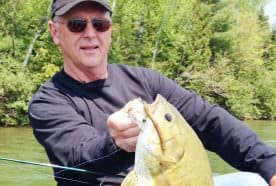 Joe Bucher with a monster smallmouth that fell for a well-presented wacky jig.