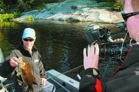 MidWest Outdoors TV Producer Matt Pollack captures the action on Crane Lake with host Scott Walsh. Photo: Roger Cormier