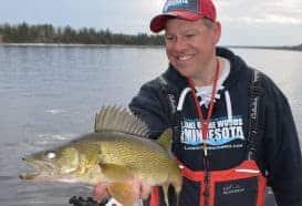 Joe Henry with a nice Rainy River walleye. A subtle adjustment of working the boat into the current with the jig well behind the boat fished horizontally vs. vertically put more fish in the boat.