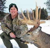 Late season is Todd Amenrud’s favorite time to hunt mature bucks. Here, he poses with a buck he killed. 