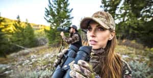 julie mcqueen with binoculars in field