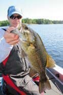 A quality ‘pre-season’ Rainy Lake smallmouth displayed by Scott Walsh. Photo: Roger Cormier