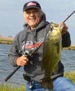 An open-water winter day, sunshine on rippling water, a submerged weed island, and long casts with a Table Rock Shad Blitz Blade helped produce this 7-pound bass and several others. 