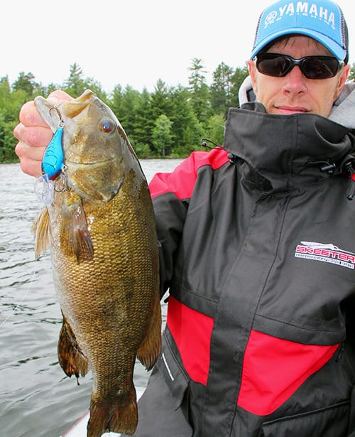 Jerkbaits and crankbaits are the bread and butter of chasin’ early-season smallies on shield lakes, and Rainy is no exception. A sample of the result on display with Scott Walsh. This one fell for the ‘butter.’