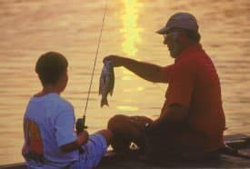 Young anglers are told at an early age to return some fish they have caught.