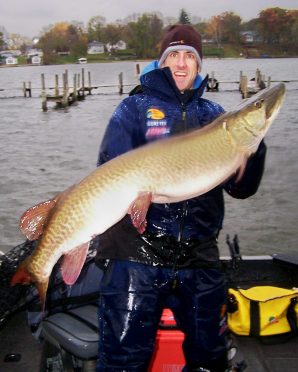 Fisherman Ryan Stochl with a near-state-record 50.75-inch muskie caught on the Fox Chain of Lakes.