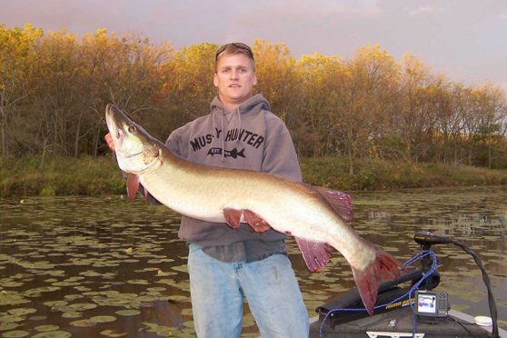 Fall fisherman with a hefty muskie taken in the waters of Illinois in 2006.