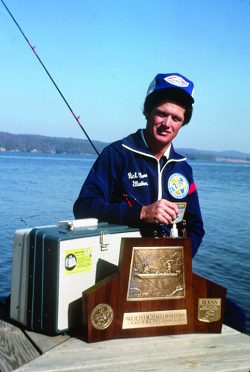 Pro fisherman Rick Clunn with his 1976 trophy plaque for winning the Bassmaster Classic.