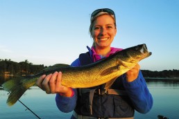 Christina Sucharski with a nice walleye that ate a swimbait on a glass-calm morning.