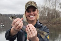 Amanda Masters of Bass Pro Shops proudly displays one of the many trout she caught during the CFM media camp at Lake Taneycomo.